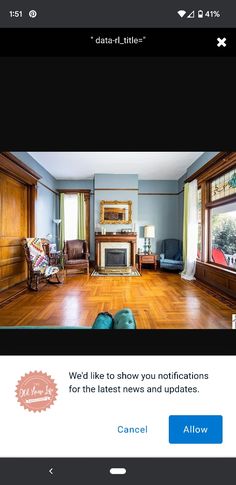 an image of a living room with wood flooring and furniture on the phone screen