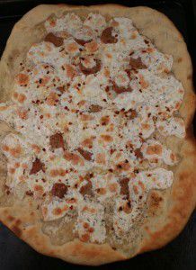 a pizza sitting on top of a pan covered in cheese