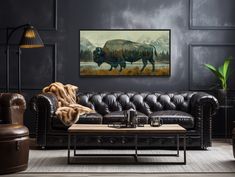 a living room filled with furniture and a painting on the wall above it's couch