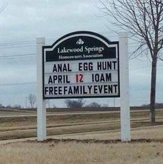 a sign for the annual egg hunt is shown in front of some trees and grass