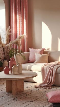 a living room filled with furniture and pink curtains