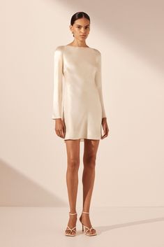 La Lune Long Sleeve Backless Mini Dress | Cream | Dresses | Shona Joy Shona Joy Short Dress, Silk Slip Wedding Dress With Sleeves, Cream Long Sleeve Silk Dress, Champagne Mini Dress With Sleeves, Minimal White Dress With Sleeves, A Line Cream Dress, Winter Engagement Party Dress, Winter Wedding Rehearsal Outfit, Fall Bridal Shower Dress