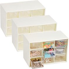 three bins filled with different types of crafting supplies and beads on a white background