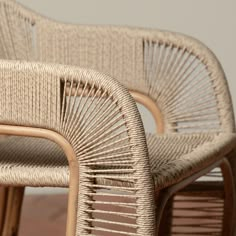 two wicker chairs sitting next to each other