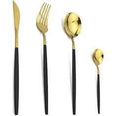 gold and black utensils are lined up on a white surface with one fork, the other spoon