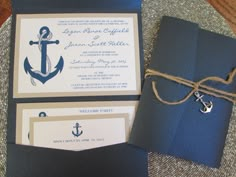 an anchor themed wedding suite is displayed on a table