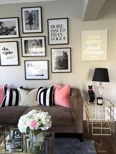 a living room filled with lots of furniture and pictures on the wall above it's coffee table