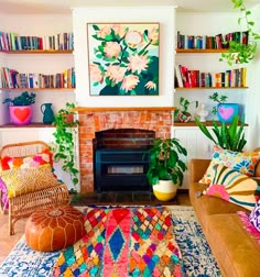 a living room filled with furniture and a fire place covered in books next to a fireplace