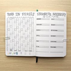 an open planner with the words year in pixels and favorite memory written on it, sitting on a wooden surface