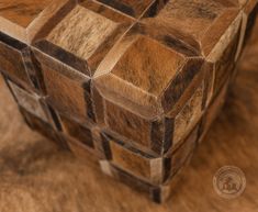 a close up of a wooden box on a table with wood grains and lines