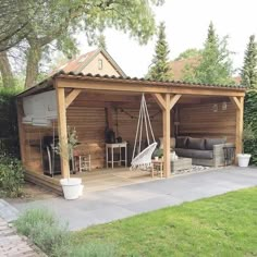 an outdoor living area with a swing set