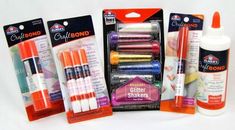 an assortment of crafting supplies including markers and glues