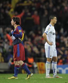 two soccer players are standing on the field