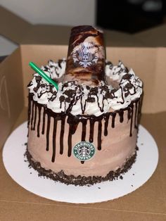 a starbucks cake with chocolate icing and whipped cream