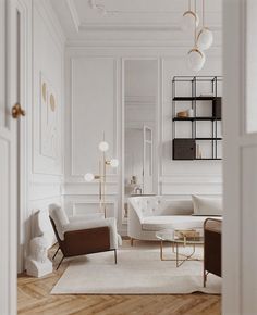 a living room with white walls and wooden floors