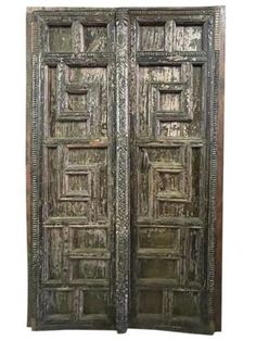 an old wooden door with intricate carvings on it