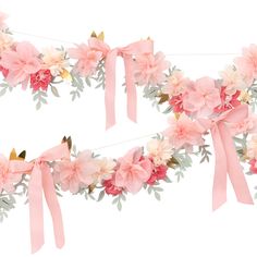 two pieces of pink ribbon with flowers and leaves hanging from the side on a white background