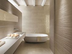 a white bath tub sitting inside of a bathroom