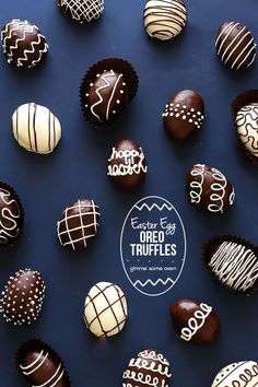 an assortment of chocolate truffles arranged on a blue surface with the words easter egg truffles written in white