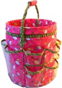 a pink and green basket with handles on it's sides, sitting in front of a white background