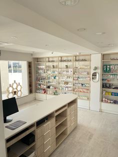 an empty pharmacy room with shelves full of medicine