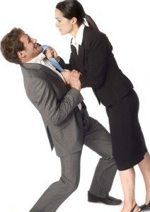 a woman helping a man with his tie in front of him on a white background