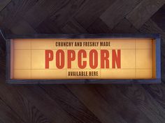 a sign that says popcorn on it