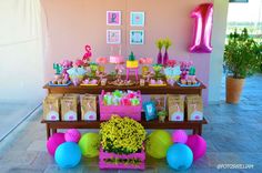 a table filled with lots of decorations and balloons