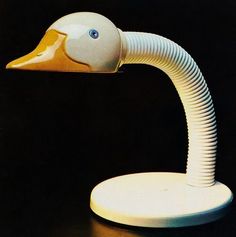 an image of a duck head lamp on a black table with light coming from it