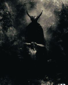 a black and white photo of a bull with horns on it's head in the dark