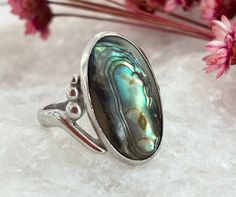 D E T A I L S: * Will arrive gift boxed * All jewelry is hand cleaned in detail Beautiful silver toned green abalone mother of pearl mood ring retro ring. Stone is natural and suuuuper beautiful.  Oval shaped with a striking center piece.  The three small balls along the side.  C O N D I T I O N: excellent vintage condition.  S I Z E: US ring size: 7.75 * measured via rod tool V I S I T  M Y  S H O P: https://thenostalgiahaus.etsy.com WHAT DOES 925 MEAN? When a piece of jewelry has 925 stamped on it, almost like a tiny engraving, it means that it is 92.5% silver and 7.5% of another metal. This 925 is called a "hallmark" and indicates high-quality sterling silver. Other hallmarks of superior sterling silver are "STG",  "S.S.", or "STER".  If it is on your gold piece, you have a gold-plated Abalone Jewelry, Hippie Rings, Mood Ring, Retro Ring, Gold Piece, Gold Plated Sterling Silver, Hallmark, Mother Of Pearl, Vintage Silver