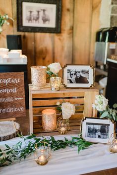 the table is set up with candles, pictures and other items for guests to use