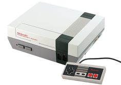 an old nintendo game console and controller