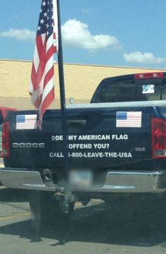 a truck with an american flag on the back