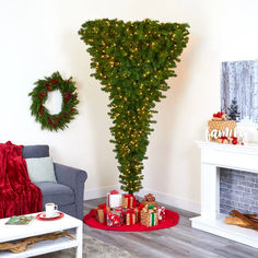 a living room decorated for christmas with presents