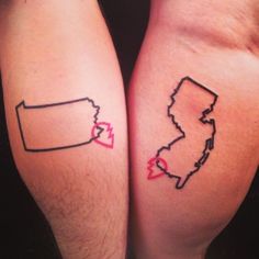 two people with matching tattoos on their legs, one has a heart and the other has a map