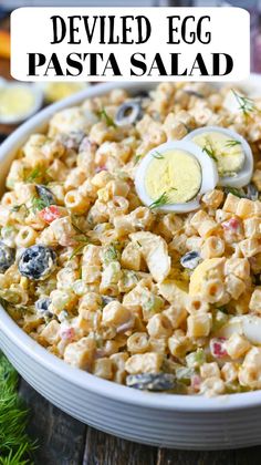 deviled egg pasta salad in a white bowl on a wooden table with text overlay