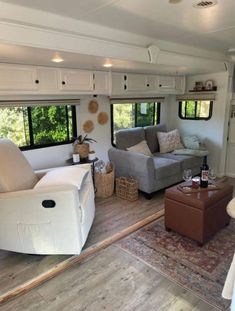 a living room filled with furniture and windows