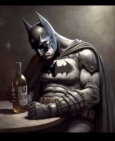 a batman sitting at a table with a bottle of wine