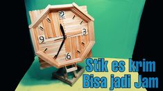 a wooden clock sitting on top of a table next to a green background with the words sitka se krim bisa jadi jam