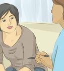 a woman sitting on a couch talking to another woman