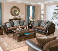 a living room filled with lots of furniture in it's centerpiece and windows