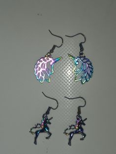 Beautiful multi chrome unicorn dangle earrings. Iridescent Metal Dangle Jewelry, Hypoallergenic Rainbow Colored Metal Jewelry, Hypoallergenic Rainbow Metal Jewelry, Rainbow Metal Earrings With Ear Wire, Rainbow Metal Earrings, Multicolor Unicorn Print Jewelry For Gift, Iridescent Metal Drop Earrings, Rainbow Dangle Metal Earrings, Rainbow Metal Drop Earrings