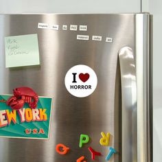 a refrigerator with magnets and stickers on it's door that says i love new york