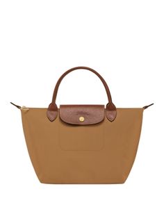 In a miniature size, Longchamp's signature nylon tote lends sophisticated style to every look. The lightweight design folds up for ease during travel. Longchamp Small Le Pliage, Top Handle Handbags, Nylon Tote, Longchamp Le Pliage, Folded Up, Small Tops, Arm Candy, Sophisticated Style, Handbags