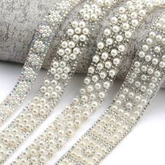 white beaded ribbon with pearls on it