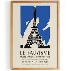 a framed poster with the eiffel tower in blue and white, on a wall