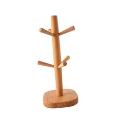 a wooden stand with three sticks on it and two holes in the middle that are used to store items