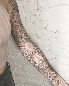 a woman with a tattoo on her arm