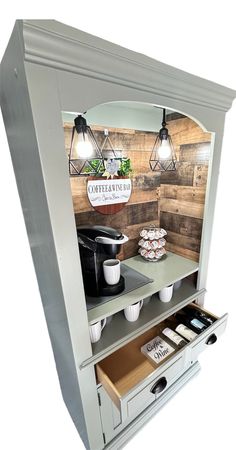 an open cabinet with coffee and pastries on it in front of a white background